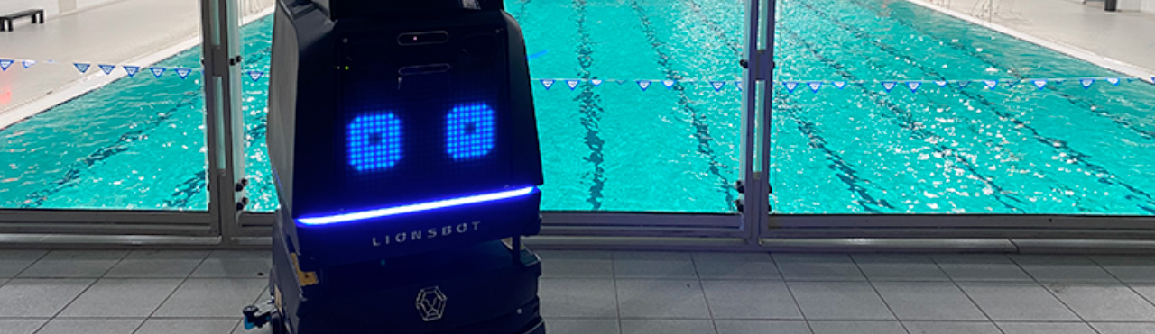 cleaning robot in front of a swimming pool